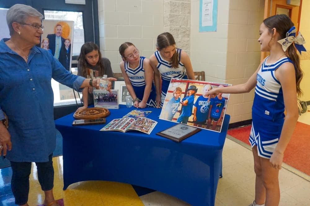 Students presenting archives from Lamar Elementary school