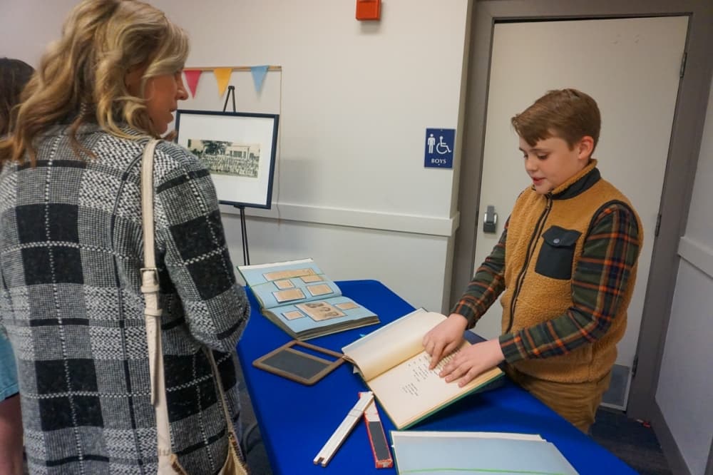 Student presenting archives from Lamar Elementary school