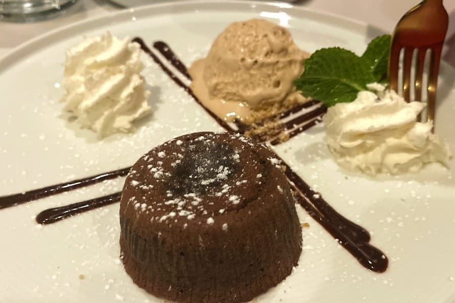 chocolate lava cake with whip cream and ice cream 