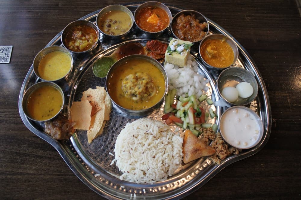 Vrindavan serves thali, a platter with several dishes, such as the Rajasthani thali ($23.99), which is offered on Monday and Friday. (Dustin Butler/Community Impact)