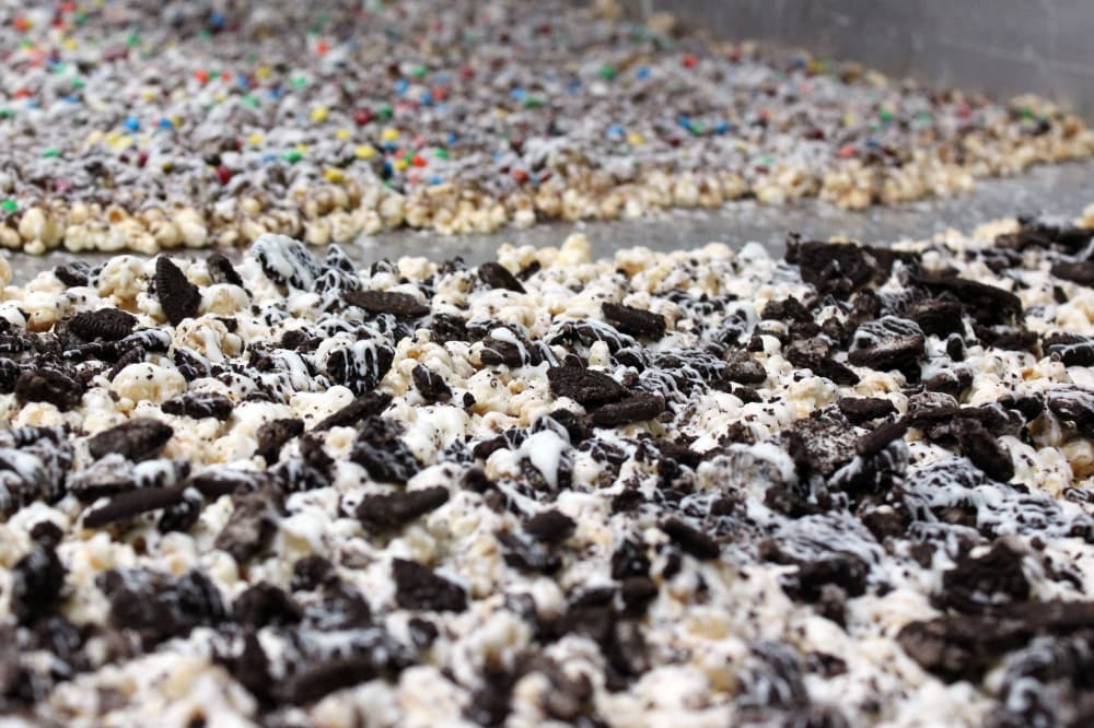 A BBatch of cookies and cream drizzle popcorn on the drying rack