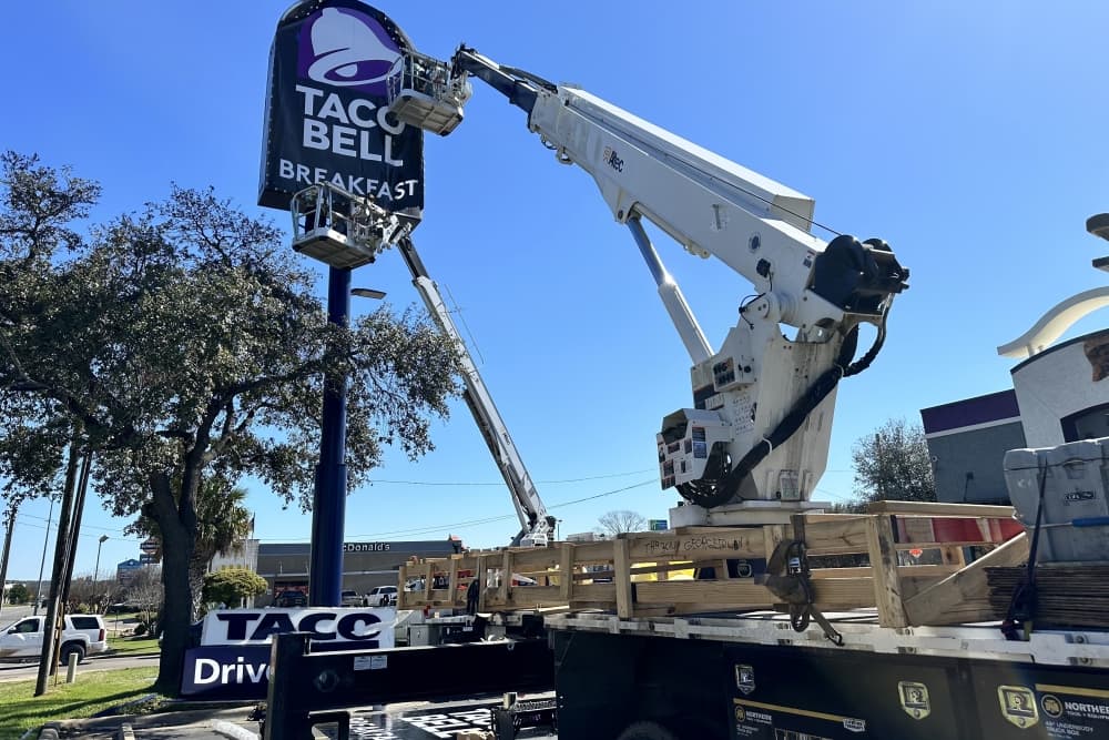 A crane is in the air working on renovations outside at the Taco Bell in Bastrop.
