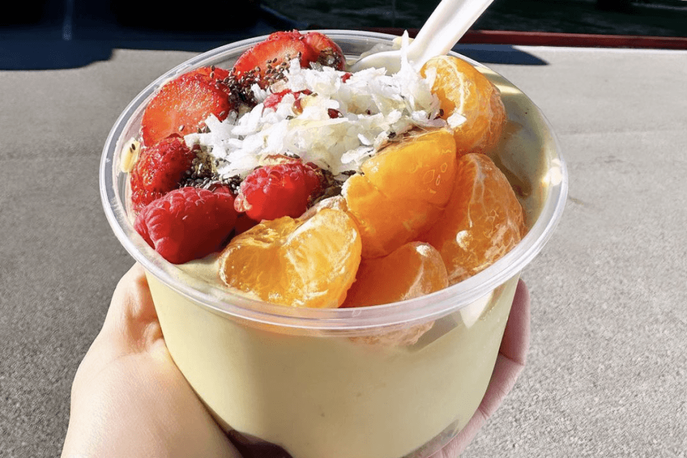 A smoothie bowl filled with fruit is shown.