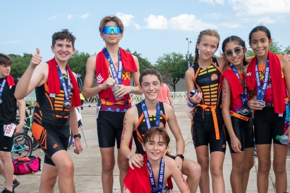 Kids participating in Kids Triathlon sponsored by the Houston Texans