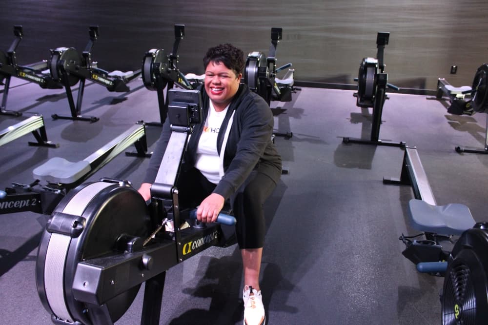 LaShonda Rahming, owner of Row House, using a rowing machine. 