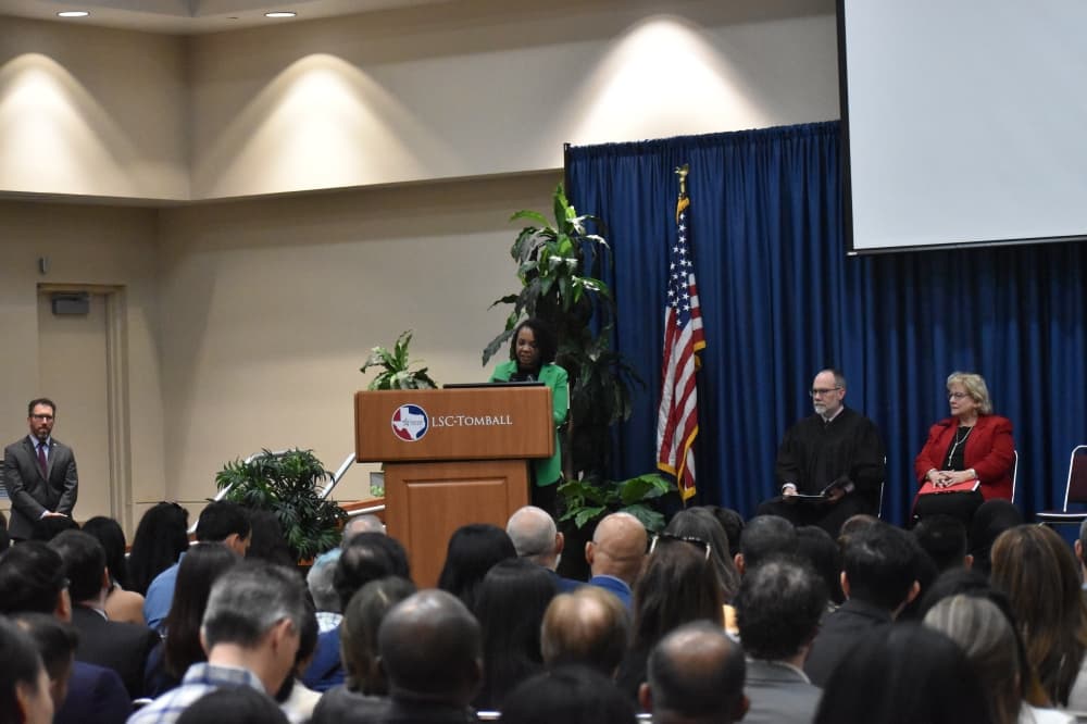 Woman at a podium speaking