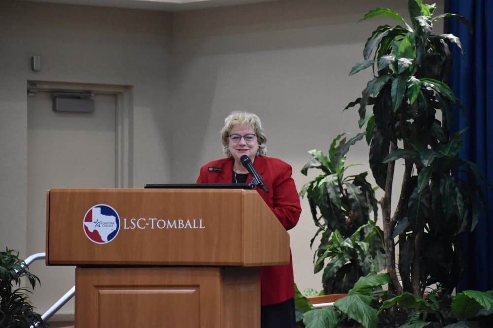 Woman at a podium speaking