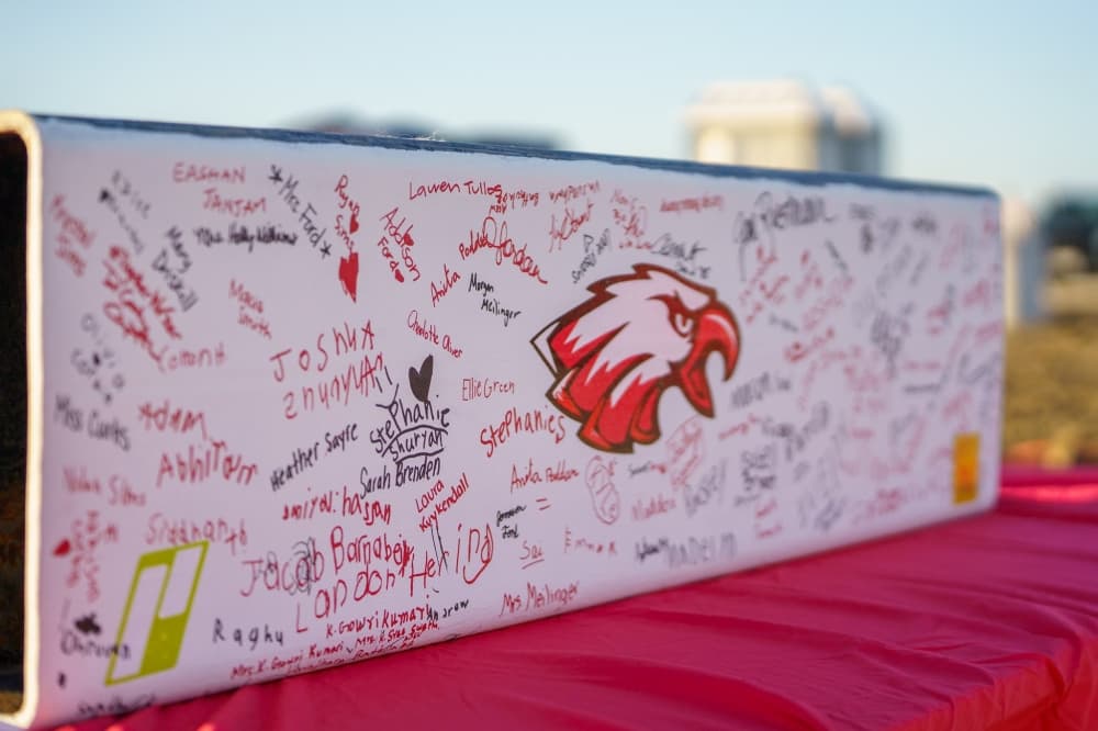 Beam sits signed at Jane Ruestmann Elementary