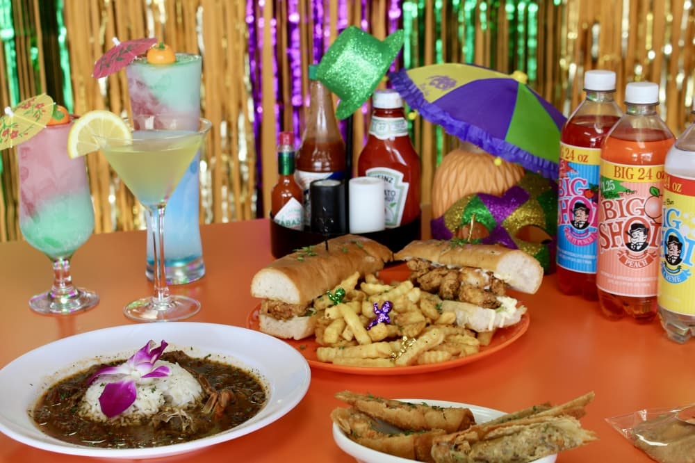 Cocktails in back of gumbo. and PoBoy