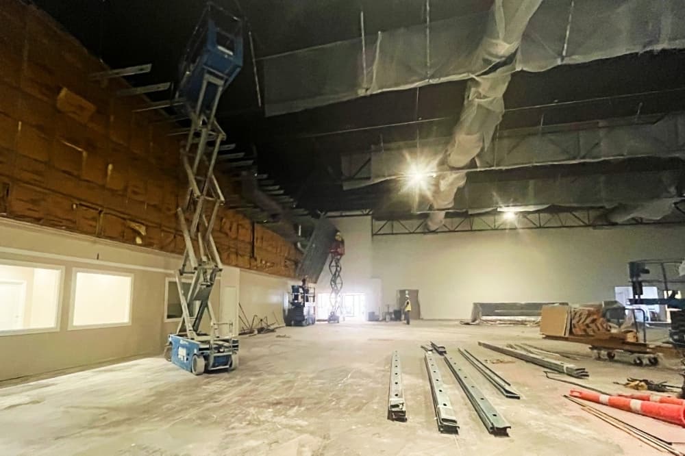 employees working inside a gym 