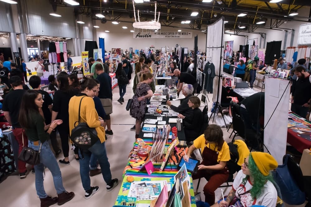 Vendors are shown as attendees browse their wares.