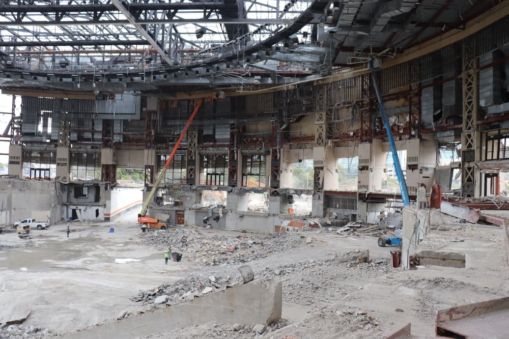 Crews are working to remove the few remaining concrete panels of the Erwin Center. (Community Impact staff)