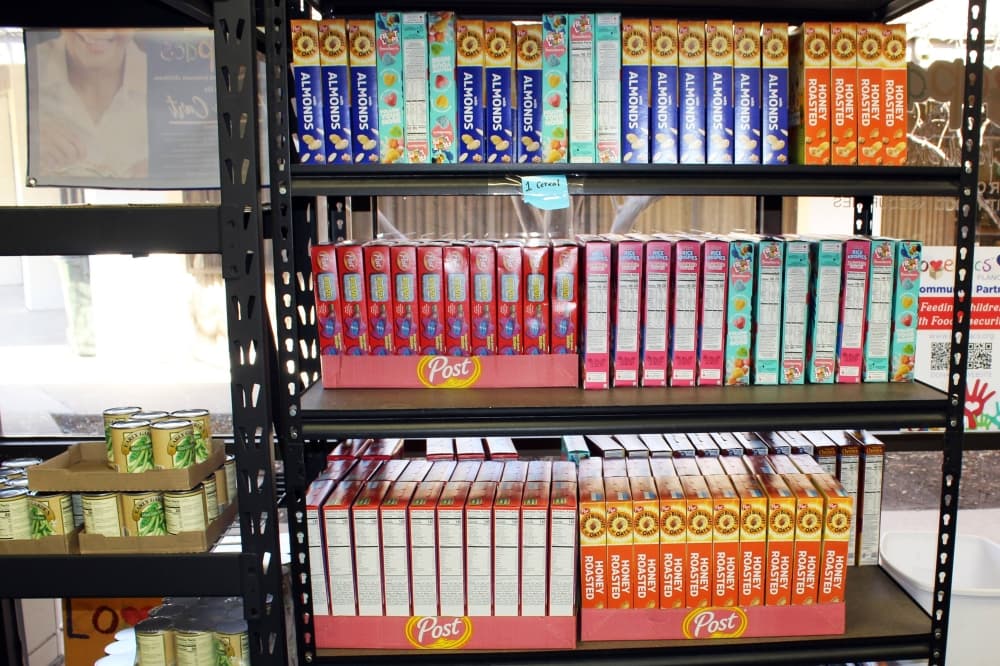 Boxes of cereal on shelves.