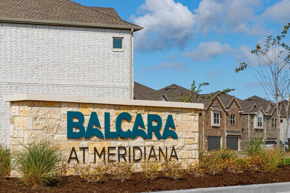 Welcome sign at the entrance of the community. (Courtesy Balcara)