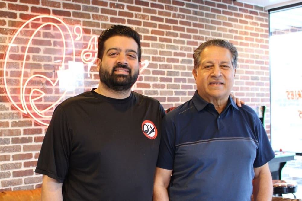 owner and father q's deli
