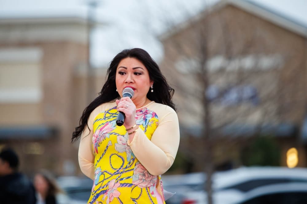 Megan Nguyen-Trinh talking into microphone
