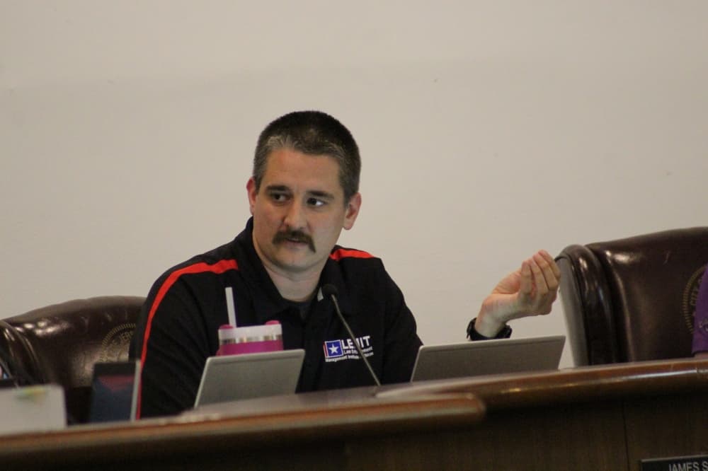 The photo shows James Singleton at a Jersey Village City Council meeting.