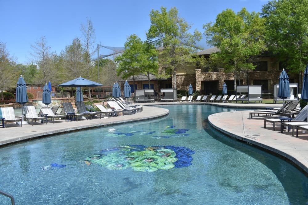 A pool with chairs around it