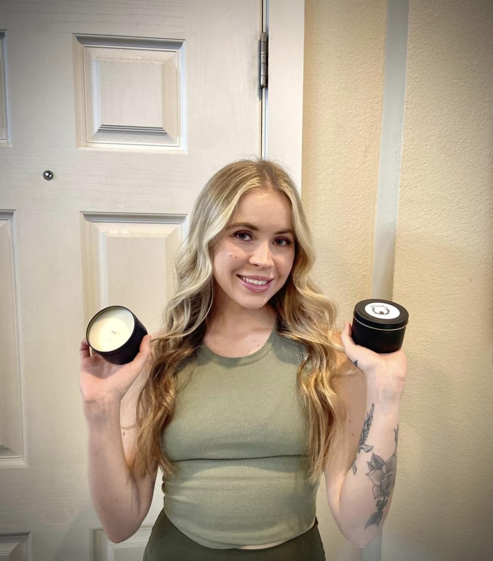  Kerri Paris holding two candles from Kerri's Kandles 