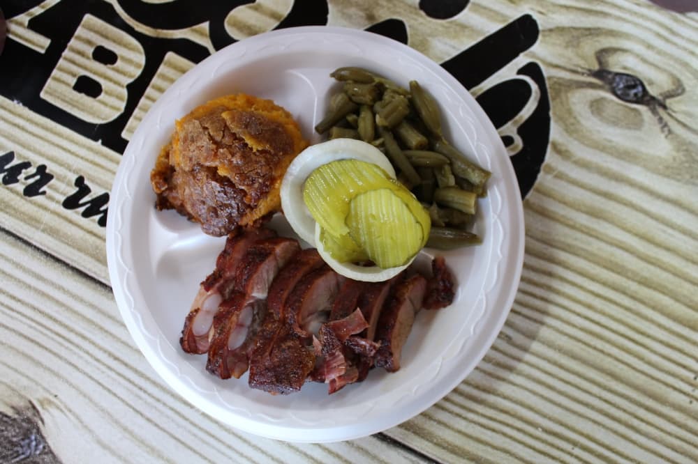 A plate at The Big Bib BBQ ($14.99) comes with a choice of meat, such as rib tips, plus two sides, such as green beans and sweet potato casserole. (Sarah Hernandez/Community Impact)