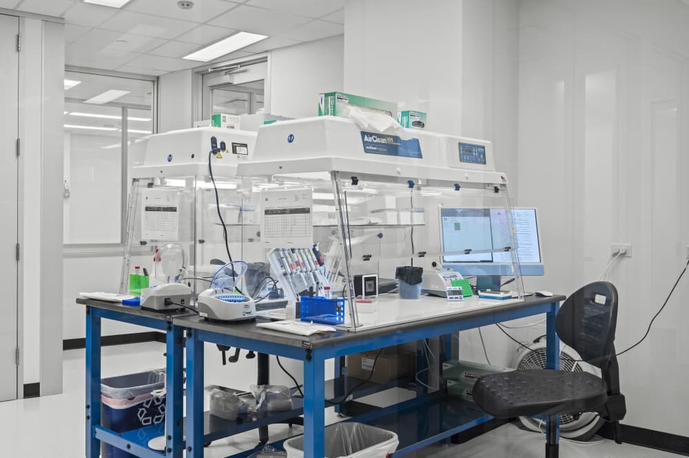 A bench with medical forensic devices in a white room.