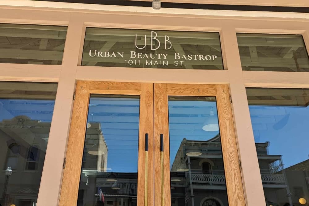 The storefront is shown with large windows at the front of the store.