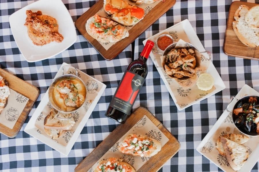 several Italian dishes laid out on a table