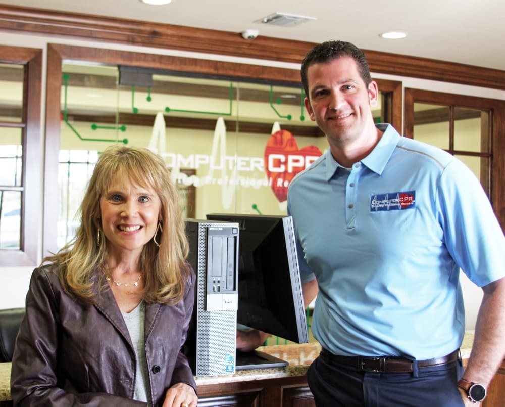 Southlake resident and CASA volunteer Elizabeth Mattson with Computer CPR Owner Michael Young, who has provided refurbished laptops to children in foster care since 2019.