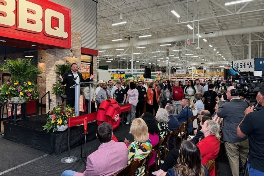 Chase Bowman introduces the team that helps him run the new H-E-B store in Alliance at the April 9 groundbreaking. (Mark Fadden/Community Impact)