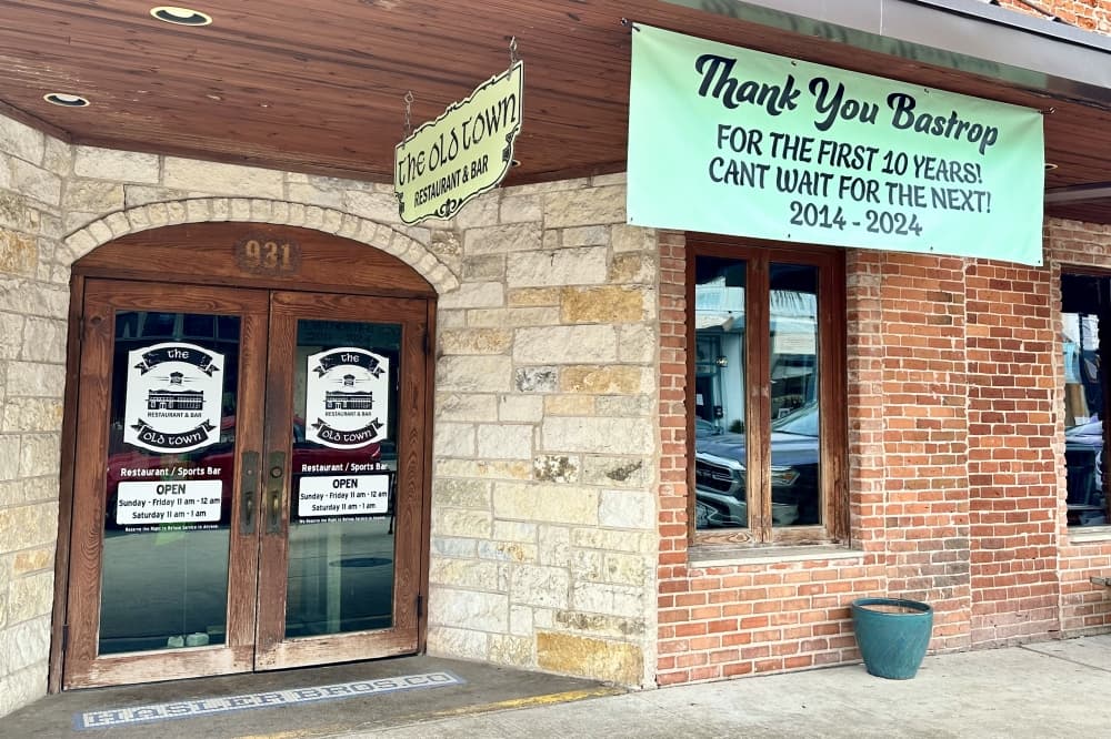An exterior shot with a 10-year anniversary banner shown.