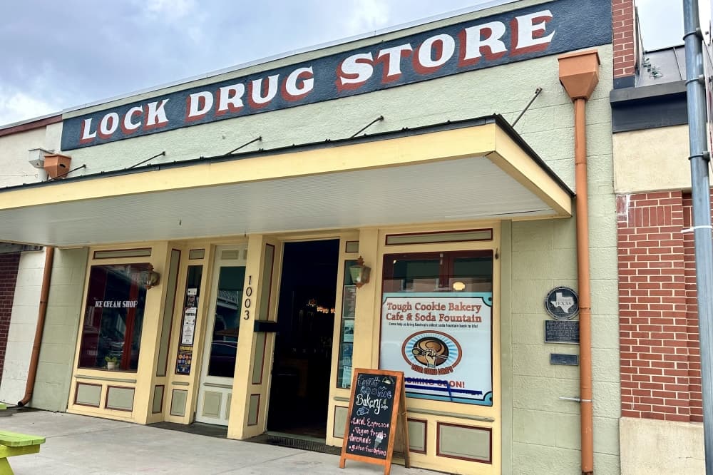 An exterior shot of the bakery is shown.