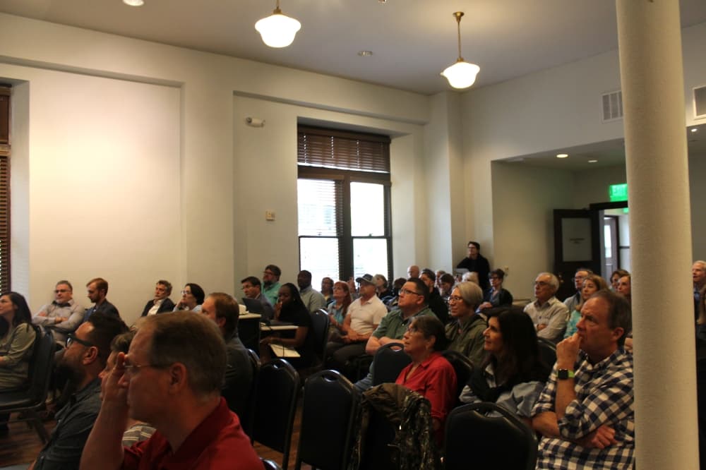 Group of people sitting at the open house event