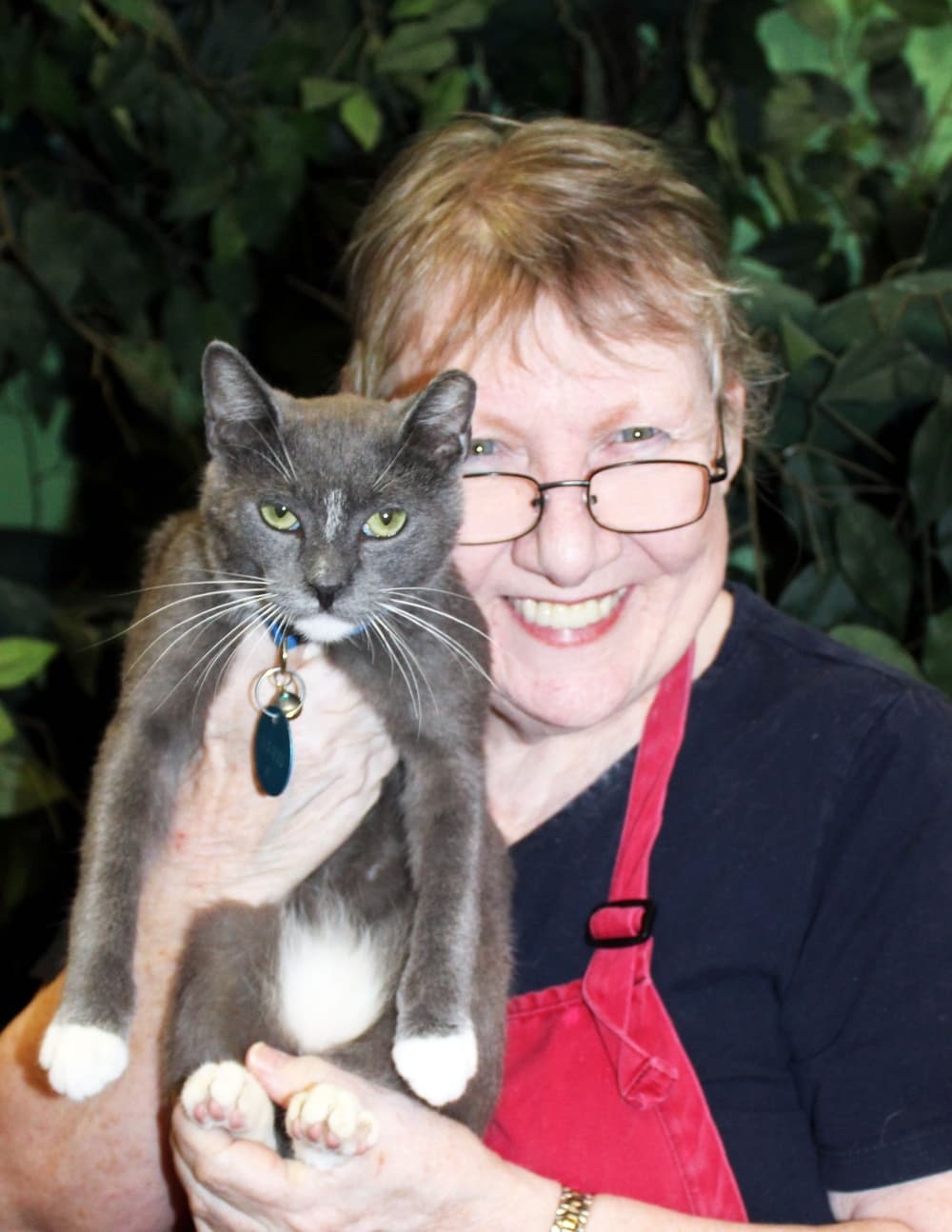 woman holding cat