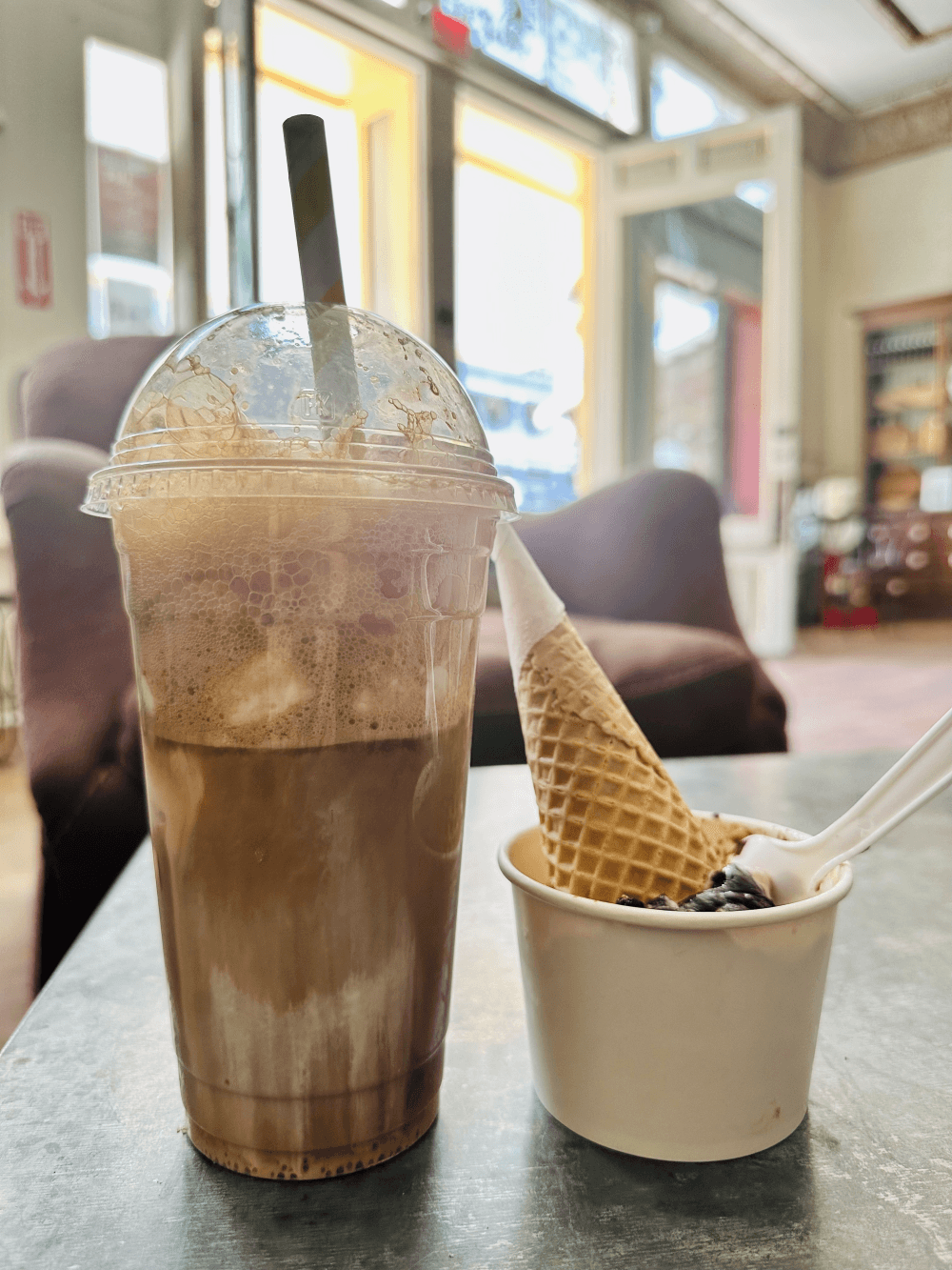 A root beer float and an ice cream cup with a cone on top are shown.