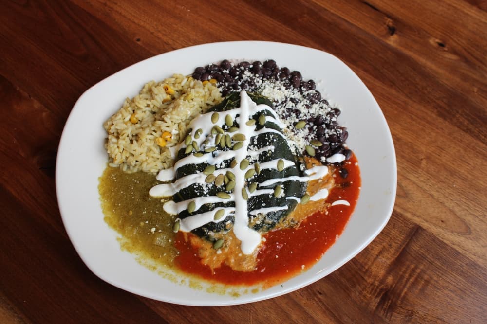 The chicken tinga chile relleno ($21) is a chili pepper stuffed with a cheese blend, pecans, apricot and raisins. (Sarah Hernandez/Community Impact)