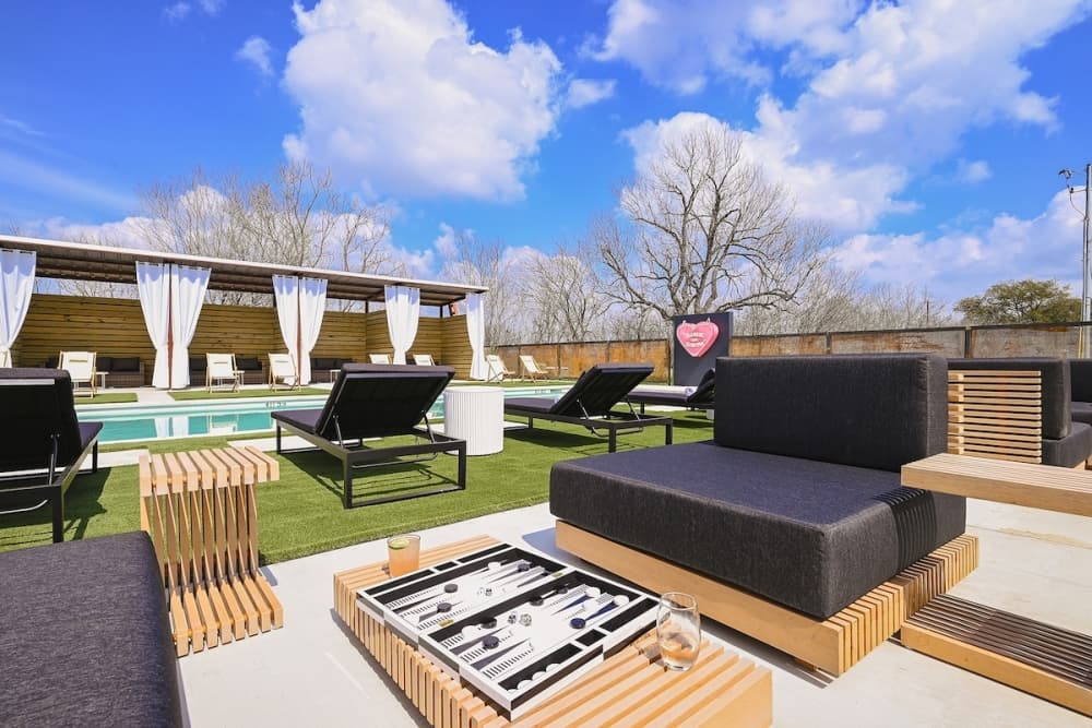 Melrose River Club features a pool with cabanas, lounge chairs and a bar. (Courtesy Melrose River Club)