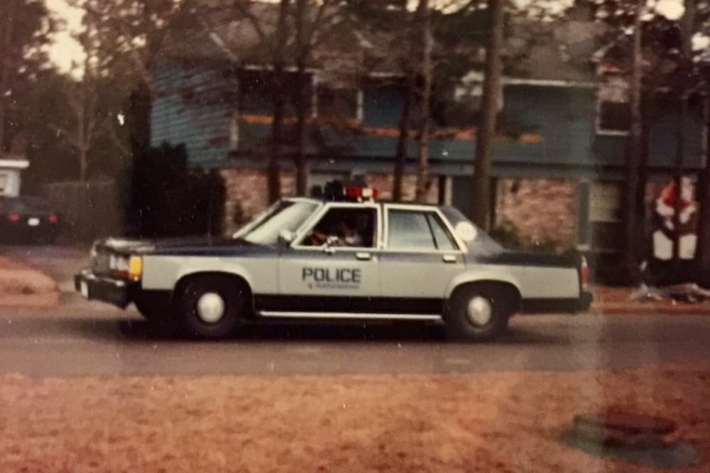 A vintage photo of a police car