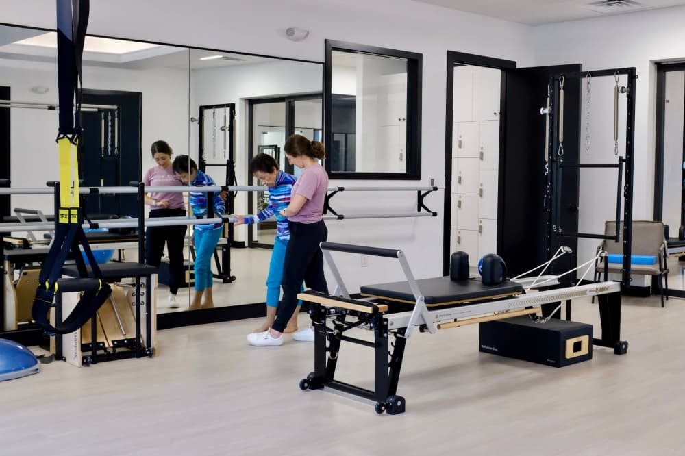 Two females in a physical therapy setting