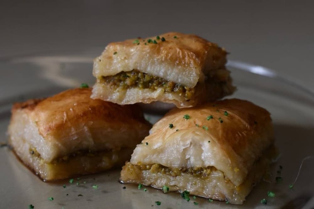 Three baklavas stacked on top of each other.