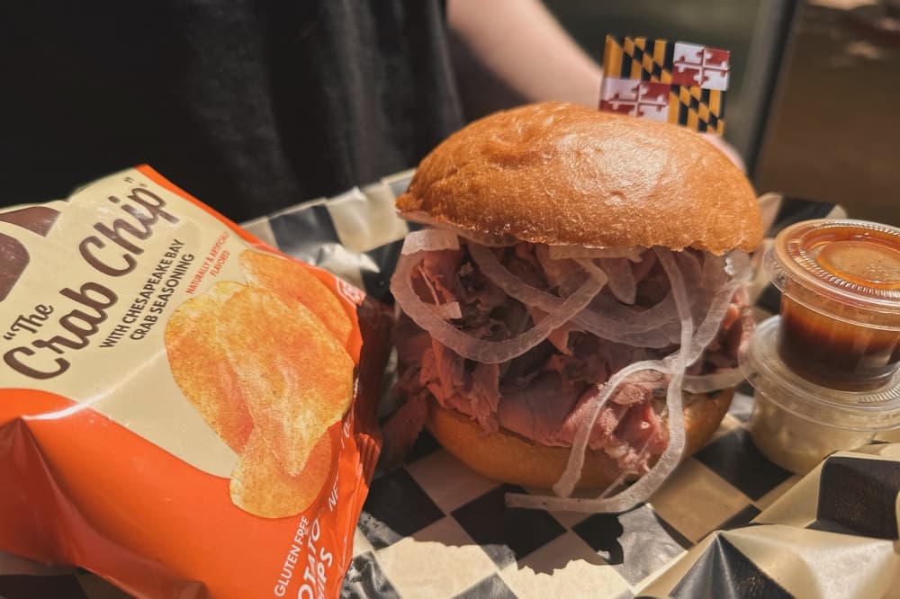A sandwich and chips are shown.