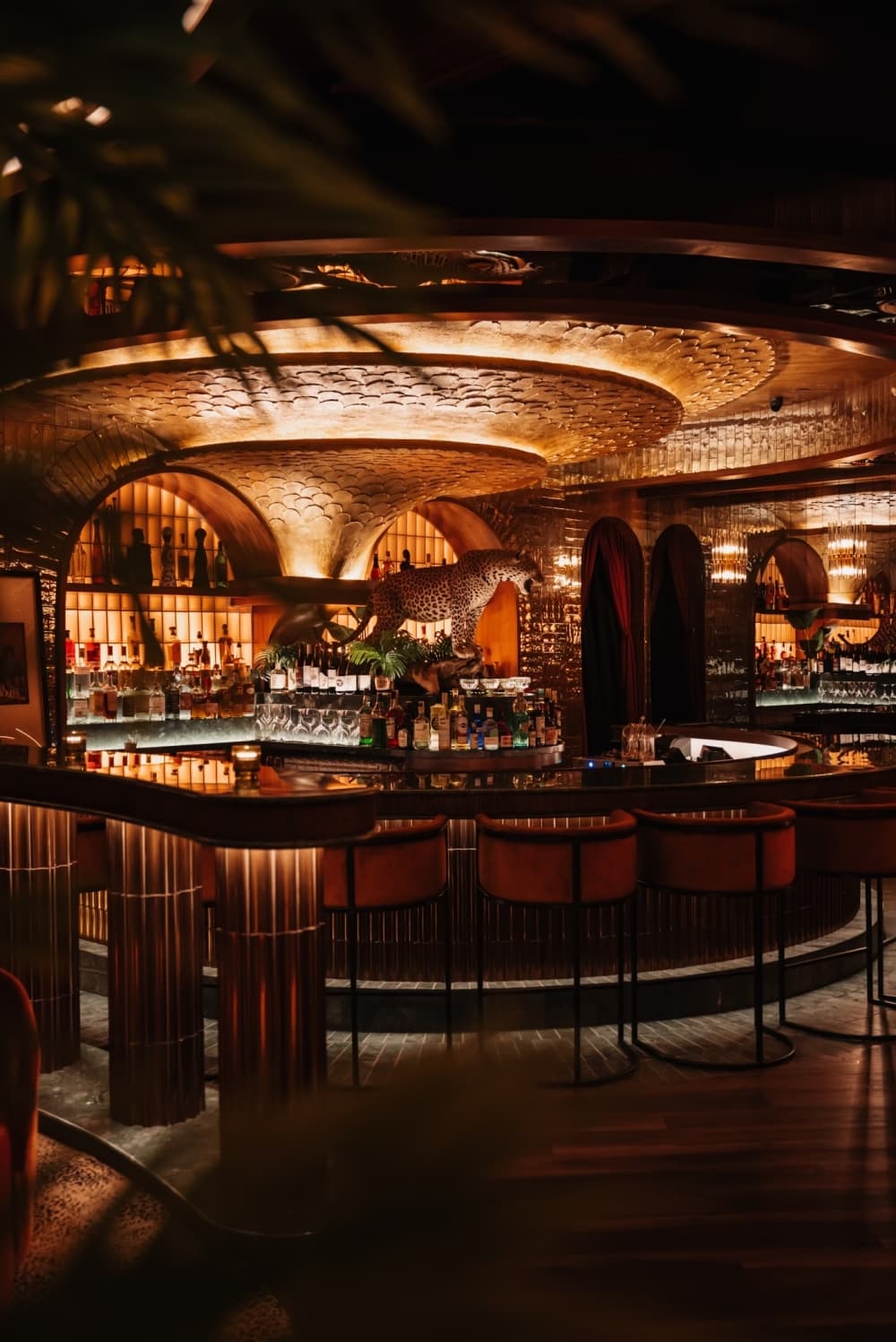 The dimly-lit bar inside the lounge is shown with elaborate decorations.