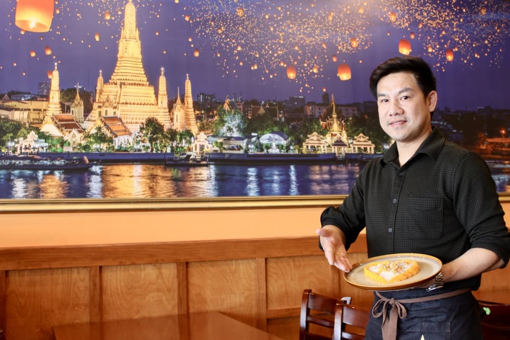owner with mango sticky rice