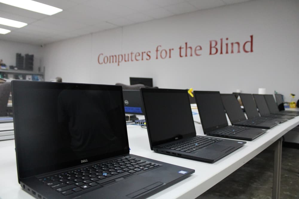 A several computers lined up. 