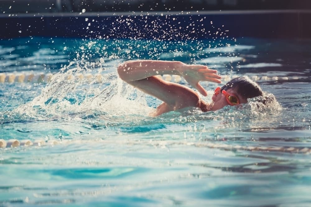 Humble ISD honors 2 long-time swim coaches with natatorium renaming