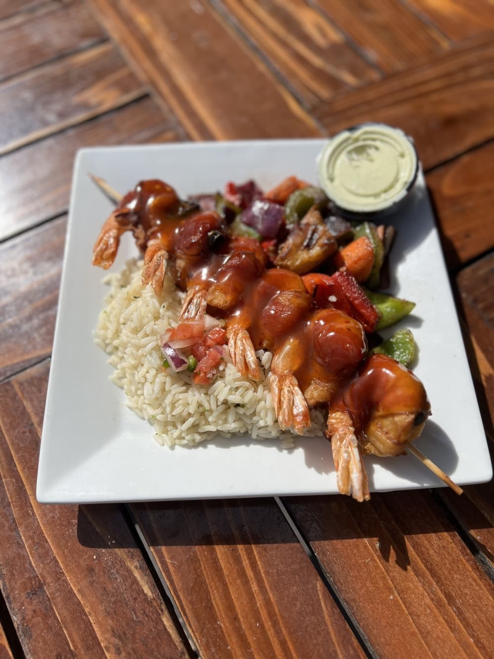 shrimp kebab with rice and orange sauce