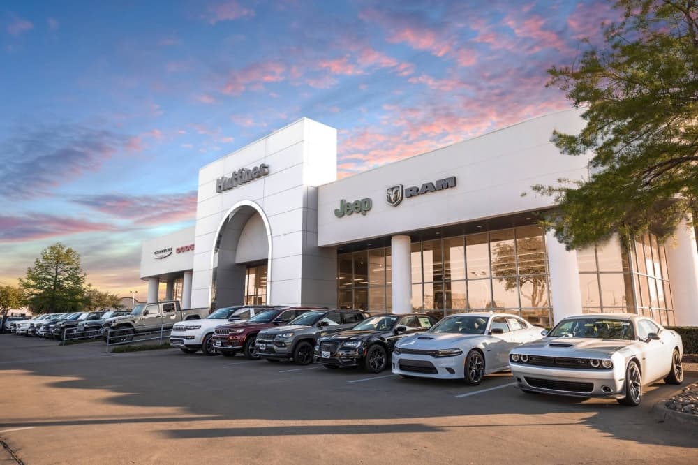 Car dealership with Huffines Chrysler Dodge Jeep Ram signage.