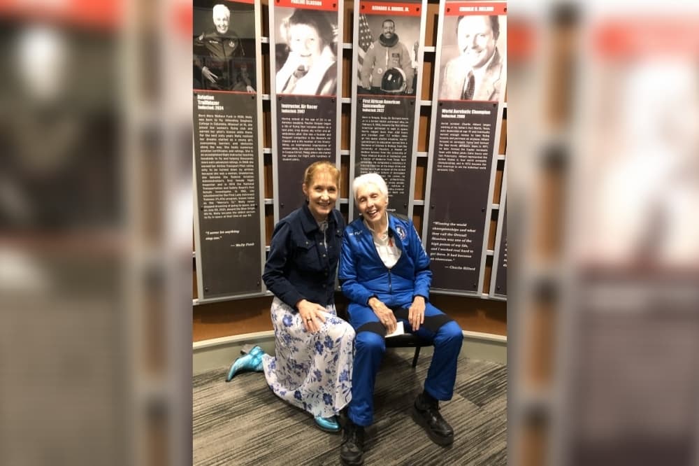 Wally Funk in front of her Texas Aviation Hall of Fame plaque with retired Gen. Jeanne Levitt, the US Air Force’s first female fighter pilot and the first woman to command a USAF Combat Fighter wing in Iraq.