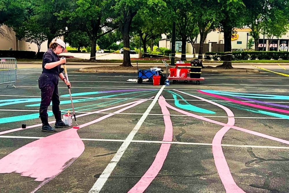 Dallas artist creating mural on parking lot near Meow Wolf Grapevine