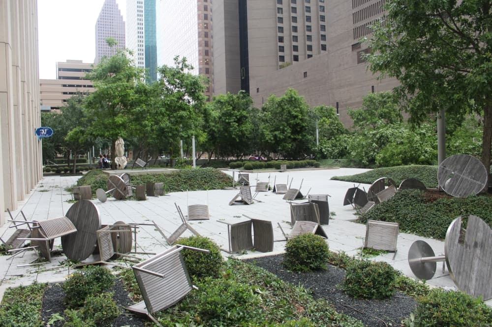 Outdoor furniture was scattered and damaged by strong winds near the Allen Center. (Shawn Arrajj/Community Impact)