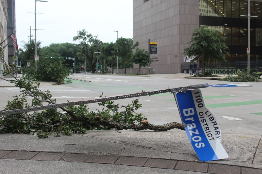 A street sign from Brazos Street was upended and left laying on the sidewalk at the Lamar Street intersection. (Shawn Arrajj/Community)